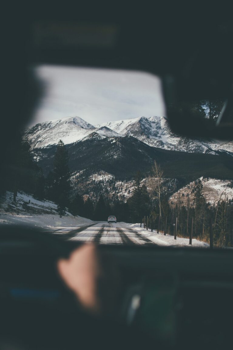 Spectacular snow-covered mountains captured from a driver's point of view.