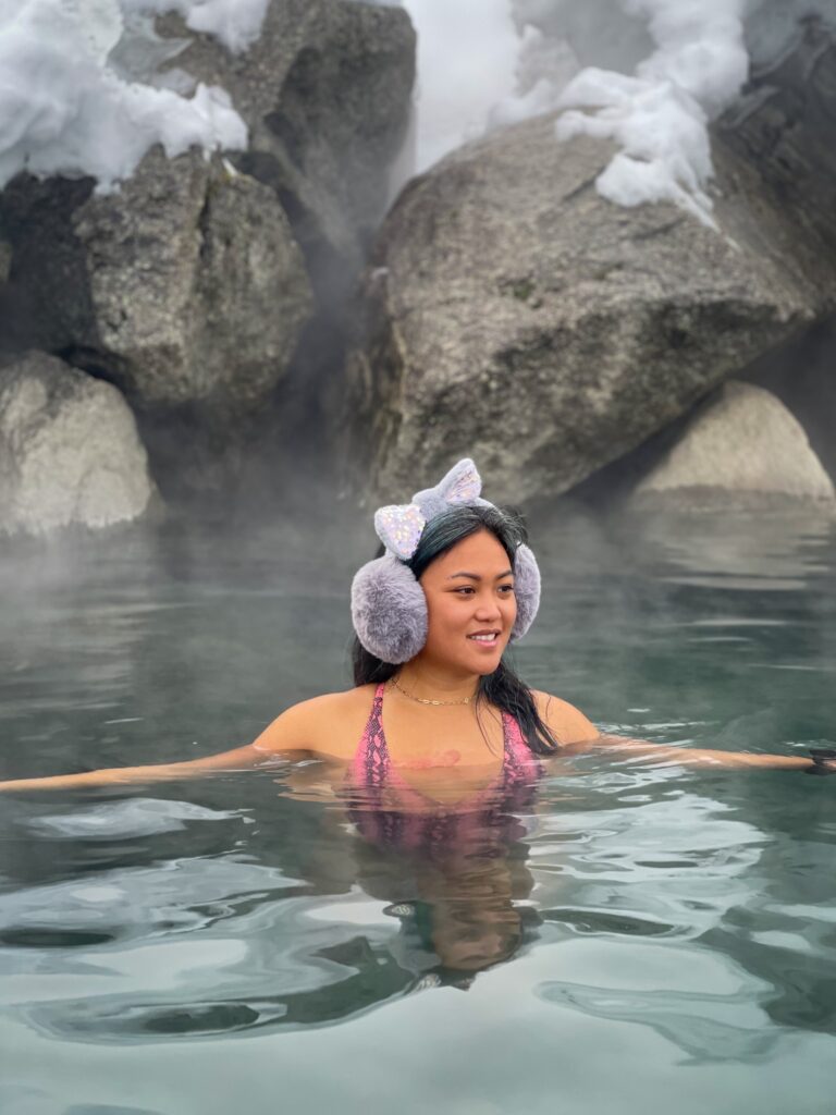 A woman enjoys the hot spring