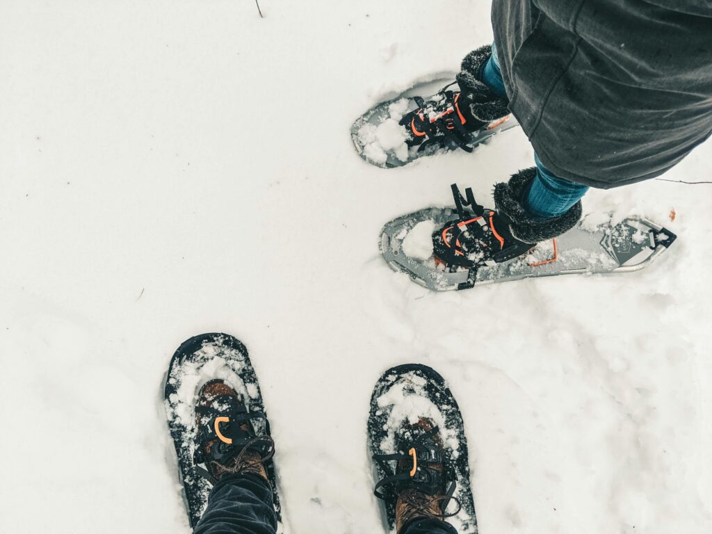 A view of two snowshoers boots standing in the snow
