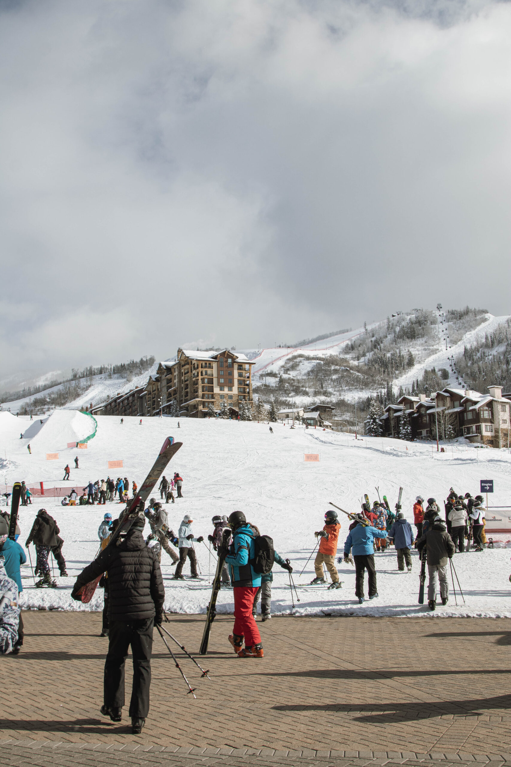 A group of skiers carrying their equipment towards Steamboat Ski Resort