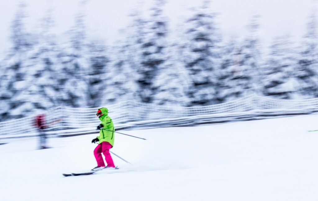 A child skis across a snowy landscape