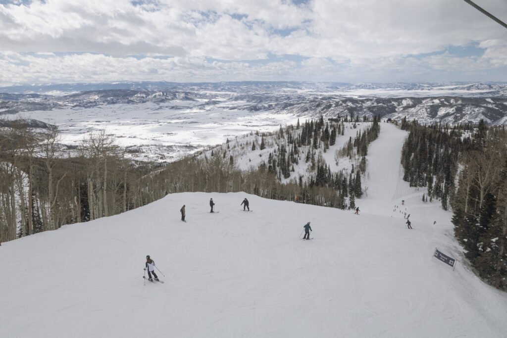 Skiers zooming down Mount Werner