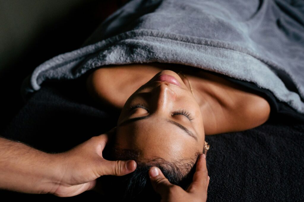 A woman enjoying a scalp massage