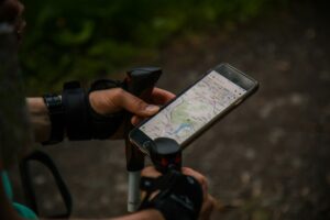 Hands using a smartphone to use a map app