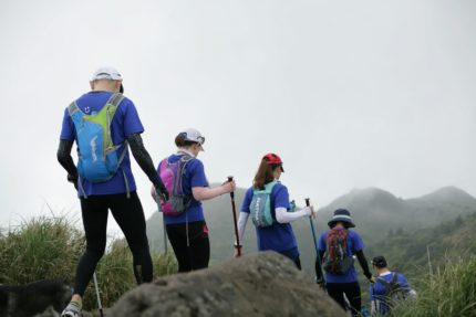 Five hikers walking away