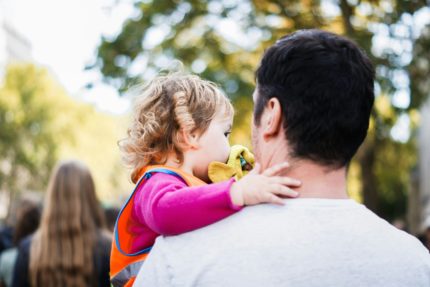 A man carrying a toddler