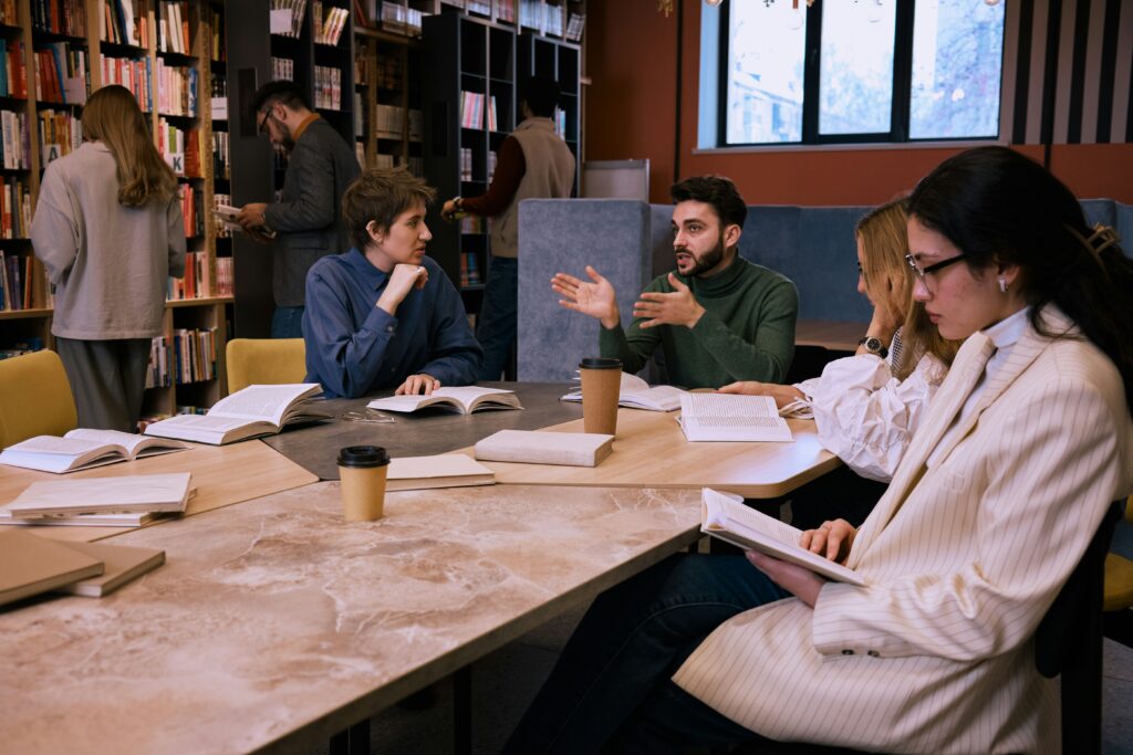 A group around a table discussing books