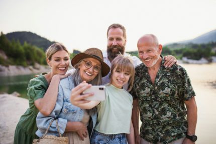 A family taking a group selfie together, enjoying the Fall family activities in Steamboat Springs