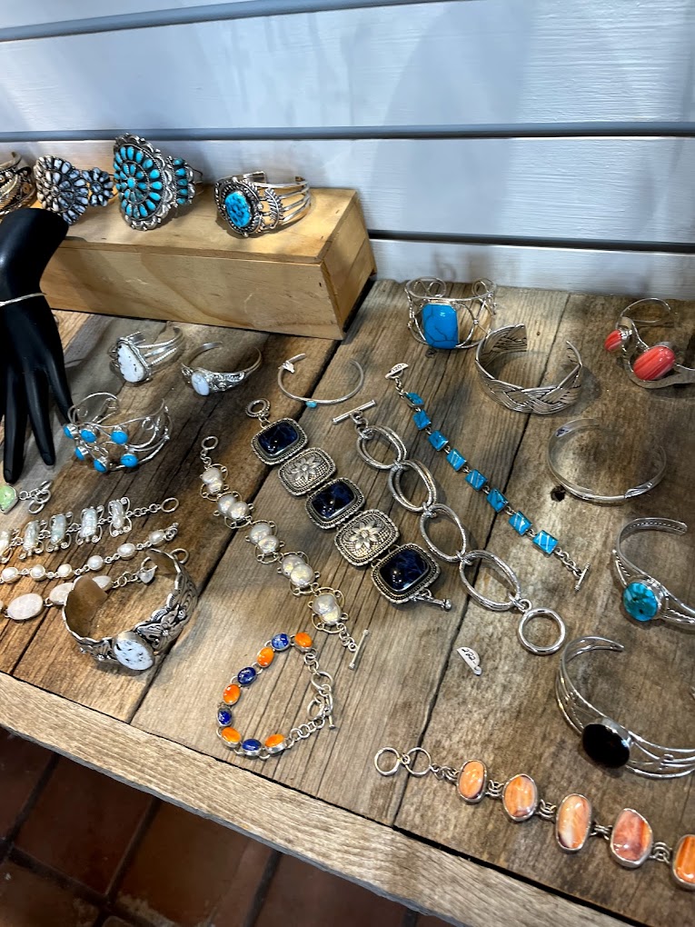 An assortment of colorful jewelry on a wooden table