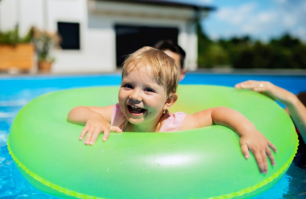 A baby in a swimming pool