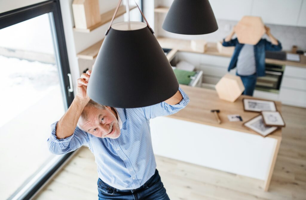 A man changing a lightbulb