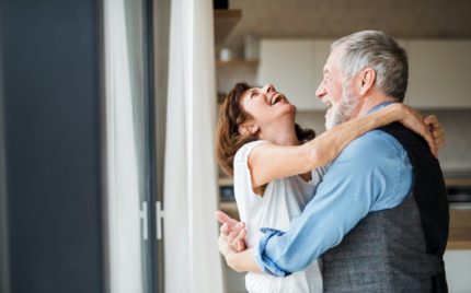 A couple embracing and laughing