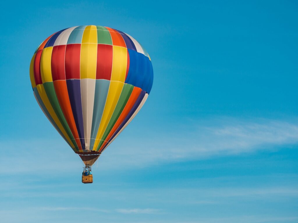 A hot air balloon against a blue sky