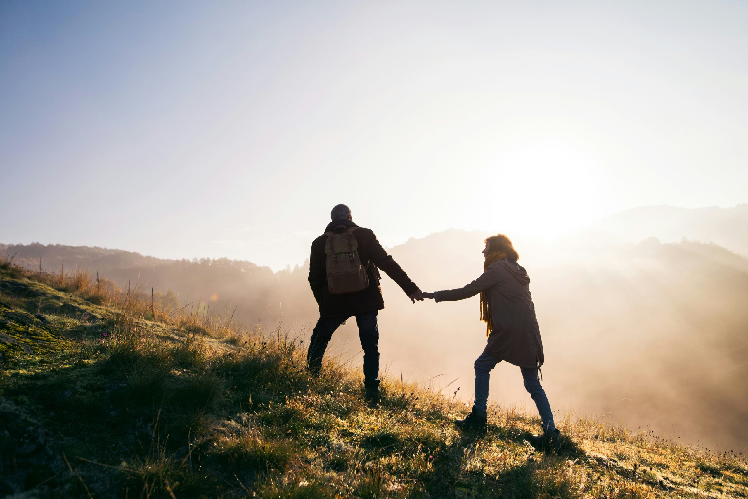 A couple exploring nature at sunset