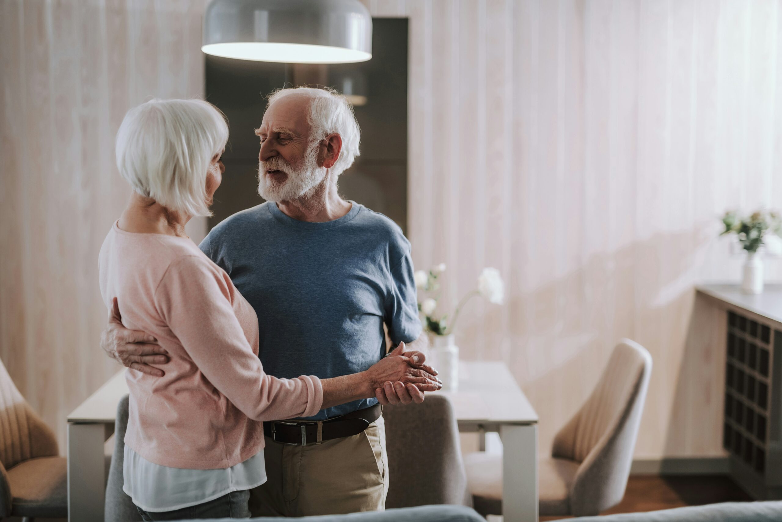 A couple dancing in their vacation home