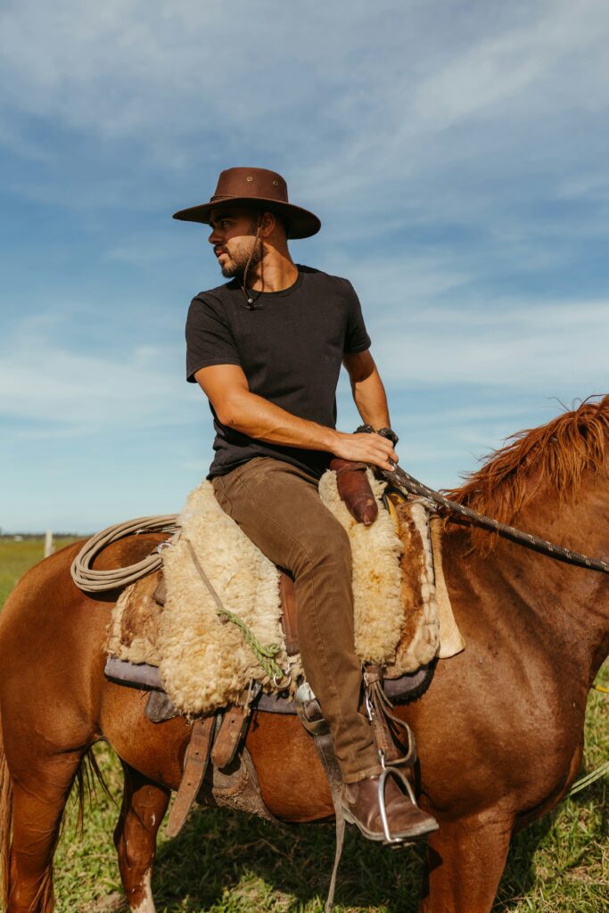 A cowboy horseback riding