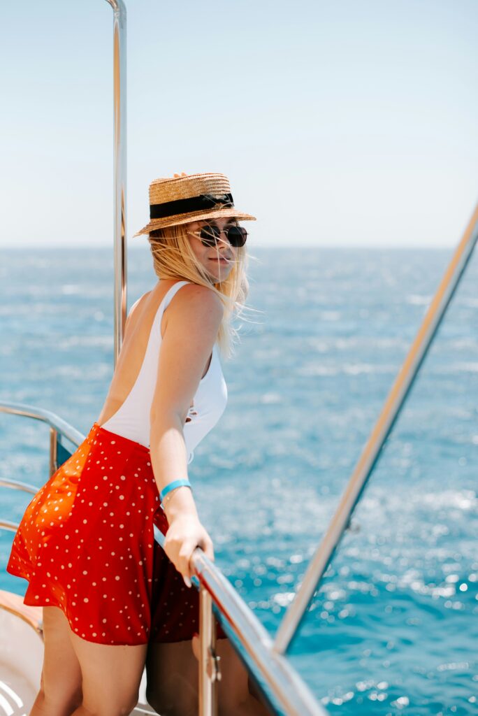 A woman on a boat looking out at the water