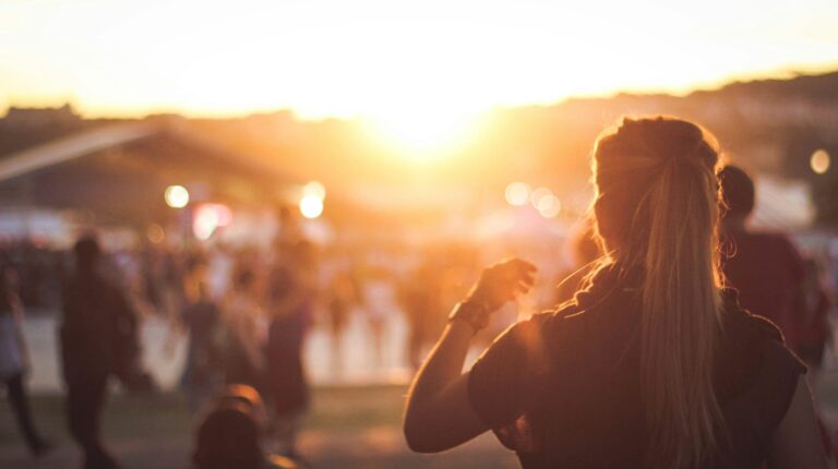 Women at outdoor concert in the glow of a sunset in Steamboat Springs.
