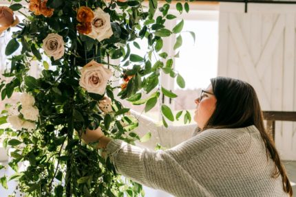 A florist setting up a floral display