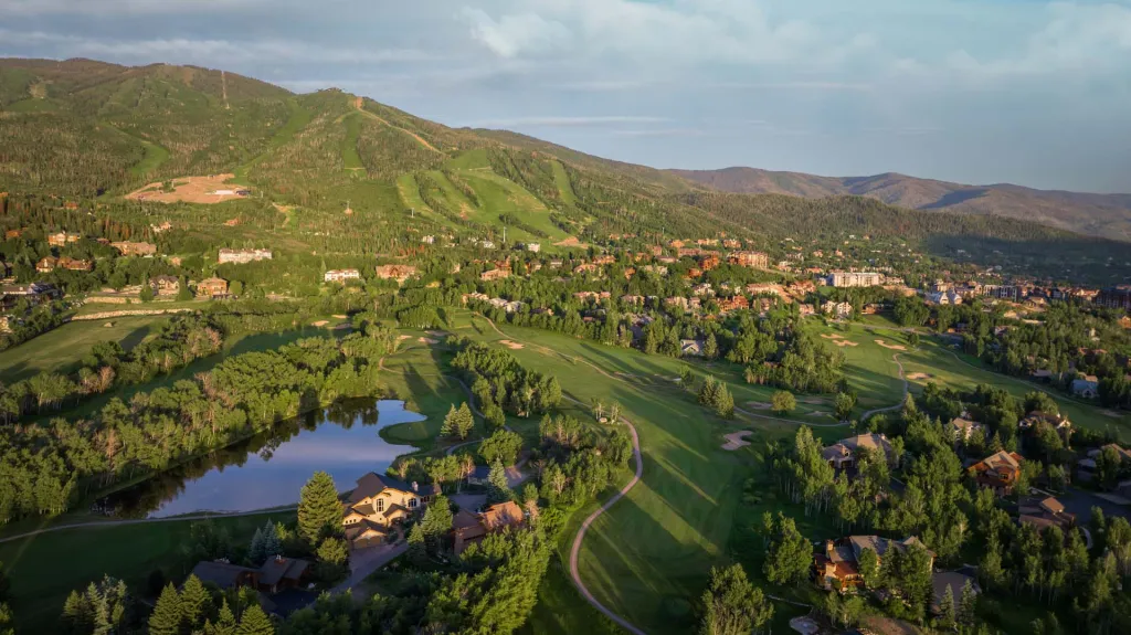 An aerial view of Rollingstone Ranch Golf Course, featuring Aspen trees and Fish Creek. One of the best places to golf in Steamboat Springs.