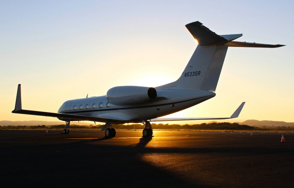 Private plane in the sunset on the runway. A way to view the fall leaves in Steamboat Springs