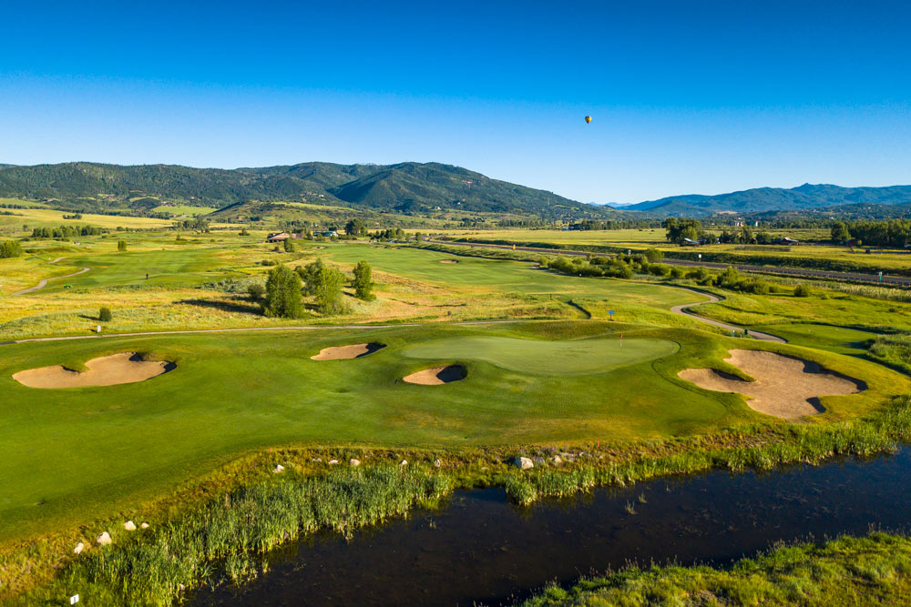 Haymaker Golf Club, featuring rolling greens and a view of Mt Werner. One of the best places to golf in Steamboat Springs. 