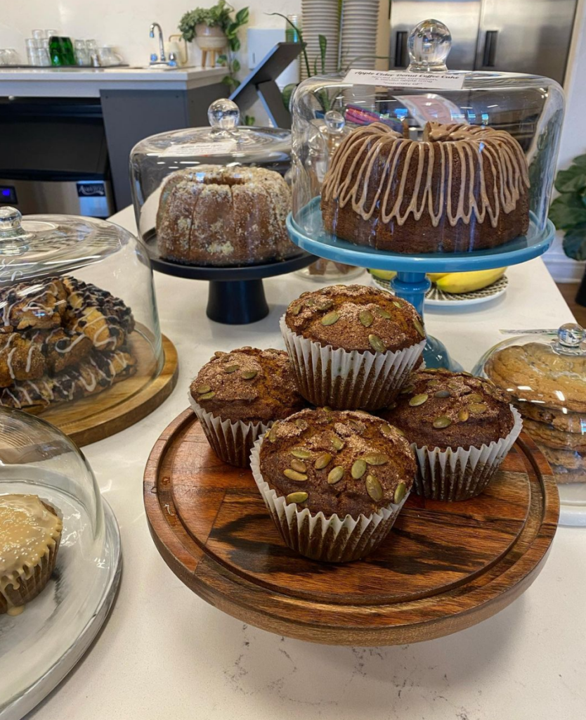 A counter-top display of fresh baked goods, including muffins and cakes. They are part of a special menu for Fall in Steamboat Springs. 