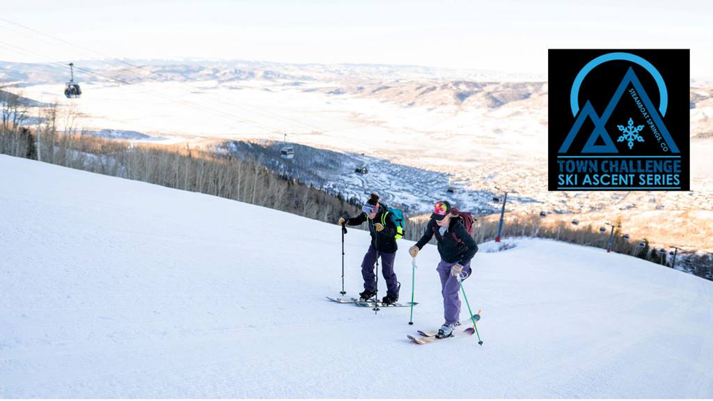 Two skiers crossing a flat snowy terrain during the Town Challenge. 