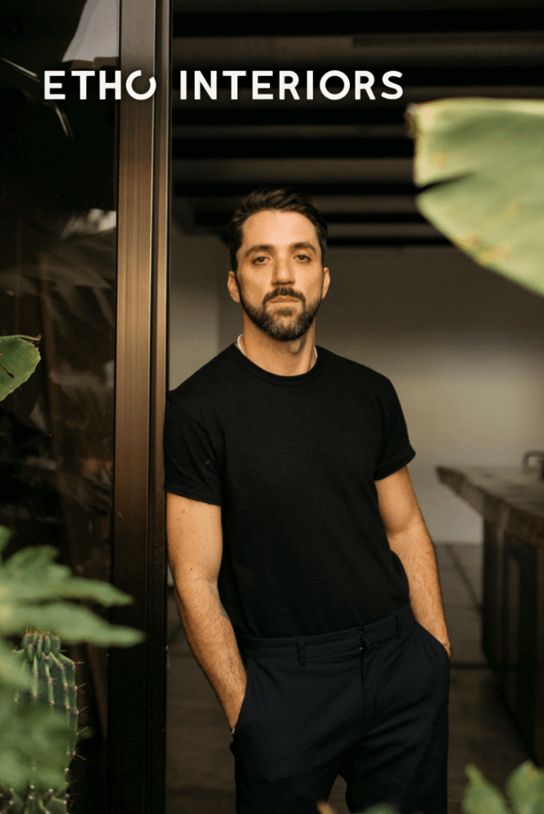 Portrait of Diego Olivero, Interior & Exterior Designer at Etho Interiors, standing in a modern interior with plants.