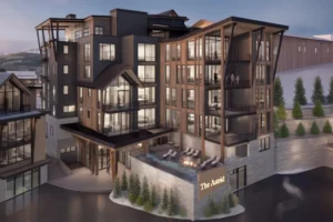 Exterior view of The Astrid mountain residences showing modern alpine architecture and building facade at dusk.