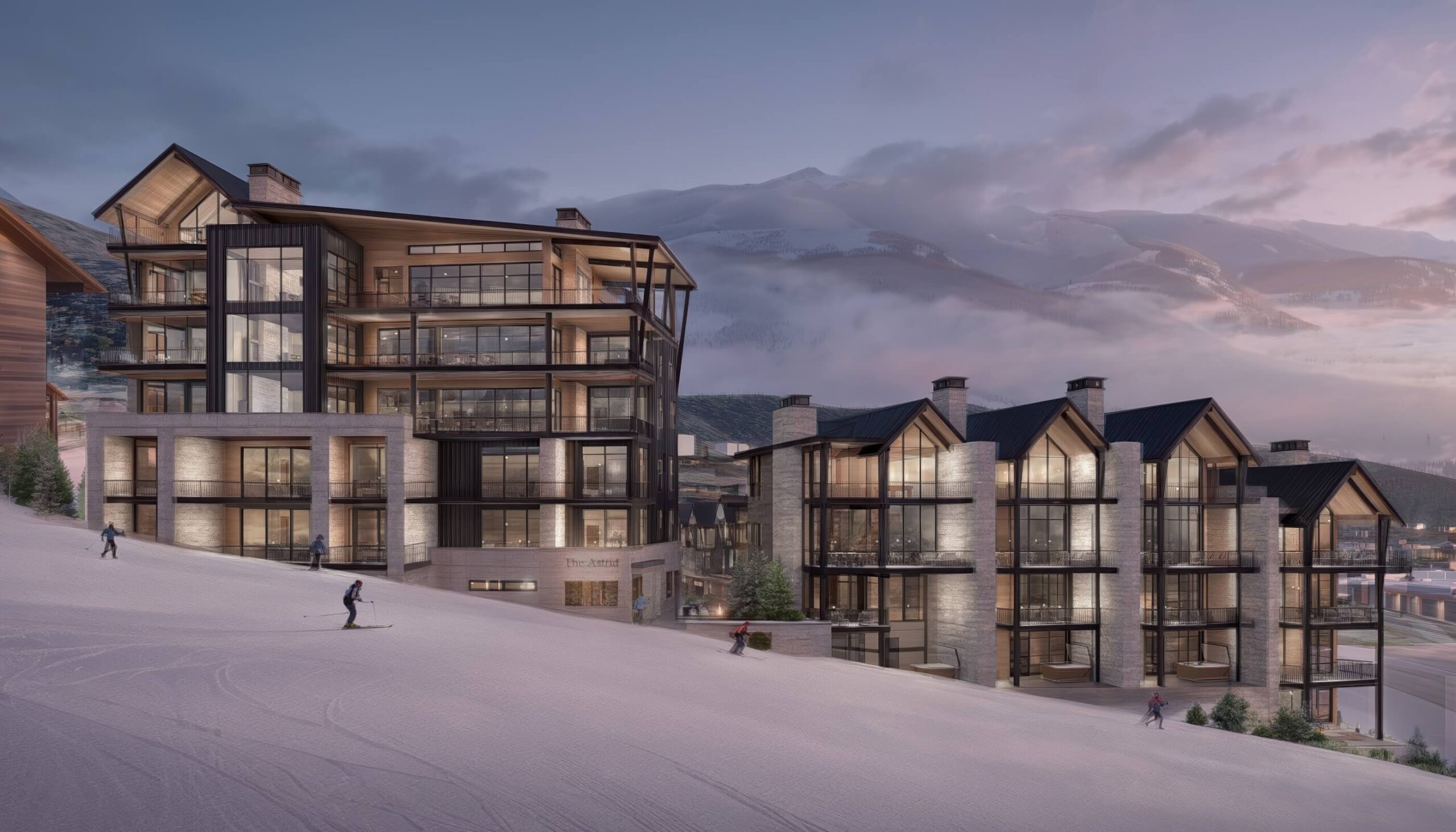 Exterior rendering of The Astrid luxury ski-in ski-out residences with illuminated glass balconies, modern mountain architecture, and skiers descending a snowy slope at dusk.