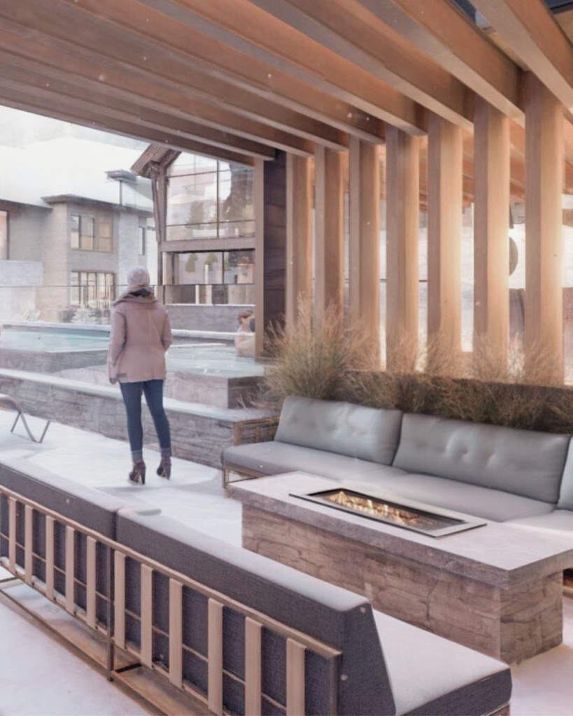 Heated outdoor terrace with seating and fire feature at a luxury mountain residence