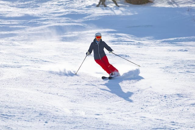Skier carving down snowy slope in Steamboat Springs