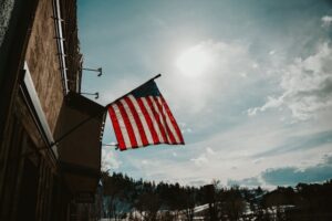 American flag outside downtown Steamboat building in winter