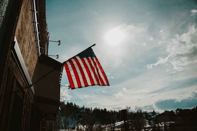 American flag outside downtown Steamboat building in winter