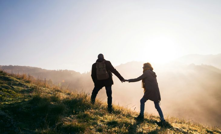 A couple exploring nature at sunset