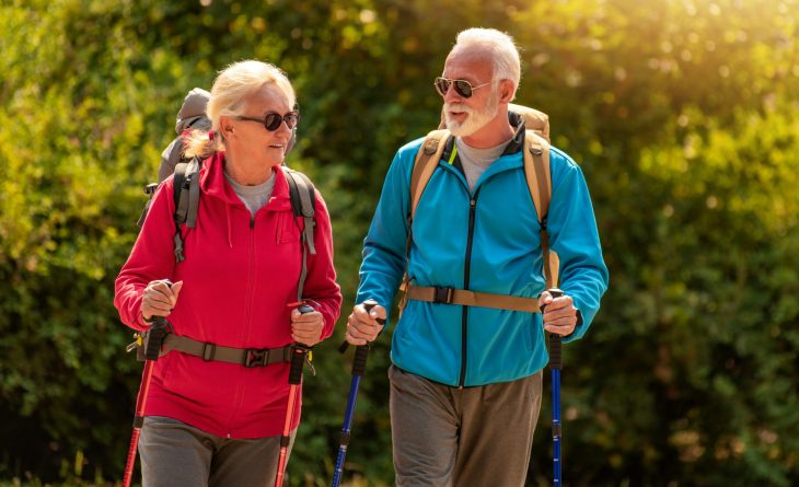 A couple hiking in the sunshine