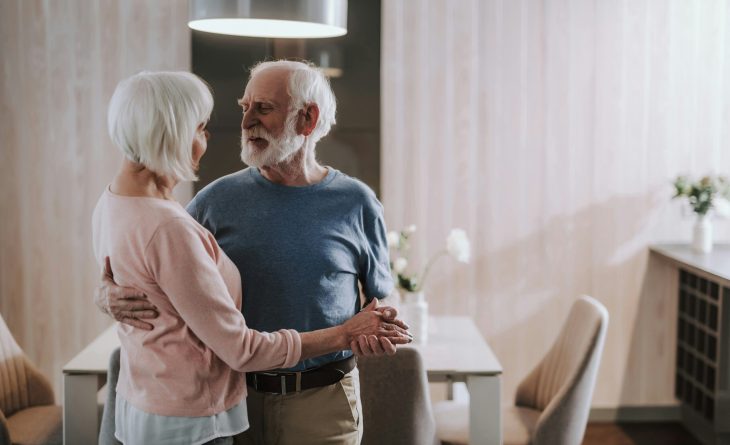 A couple dancing in their vacation home