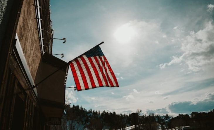 American flag outside downtown Steamboat building in winter