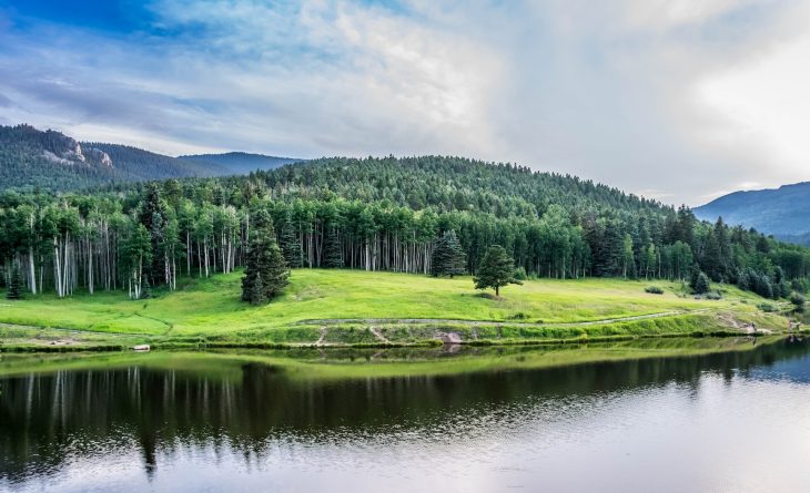 Spectacular mountainous landscape featuring a picturesque lake in the foreground.