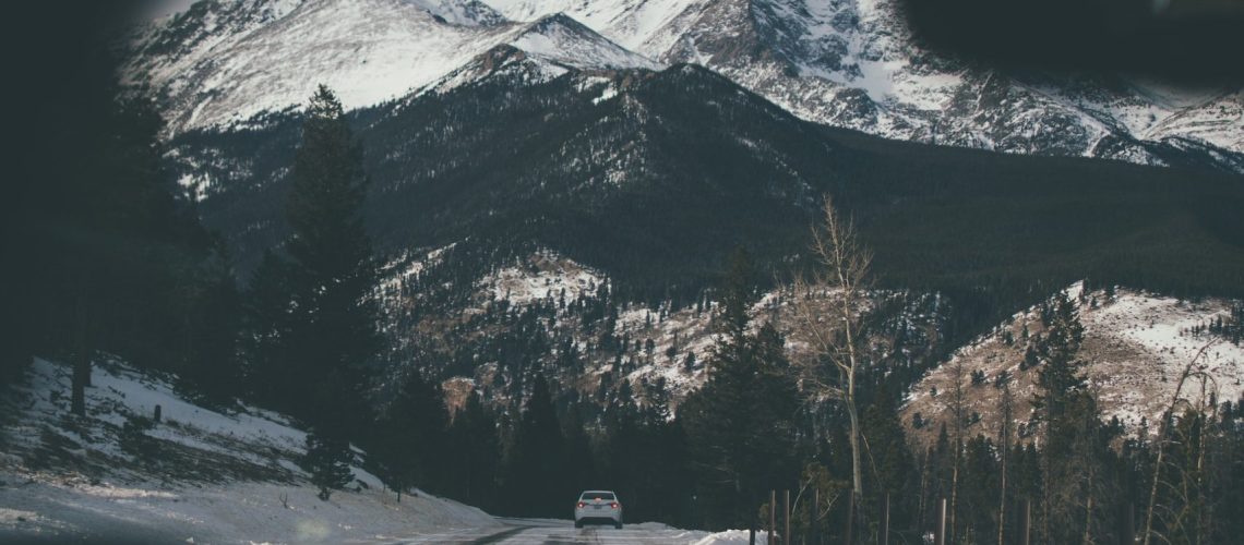 Spectacular snow-covered mountains captured from a driver's point of view.